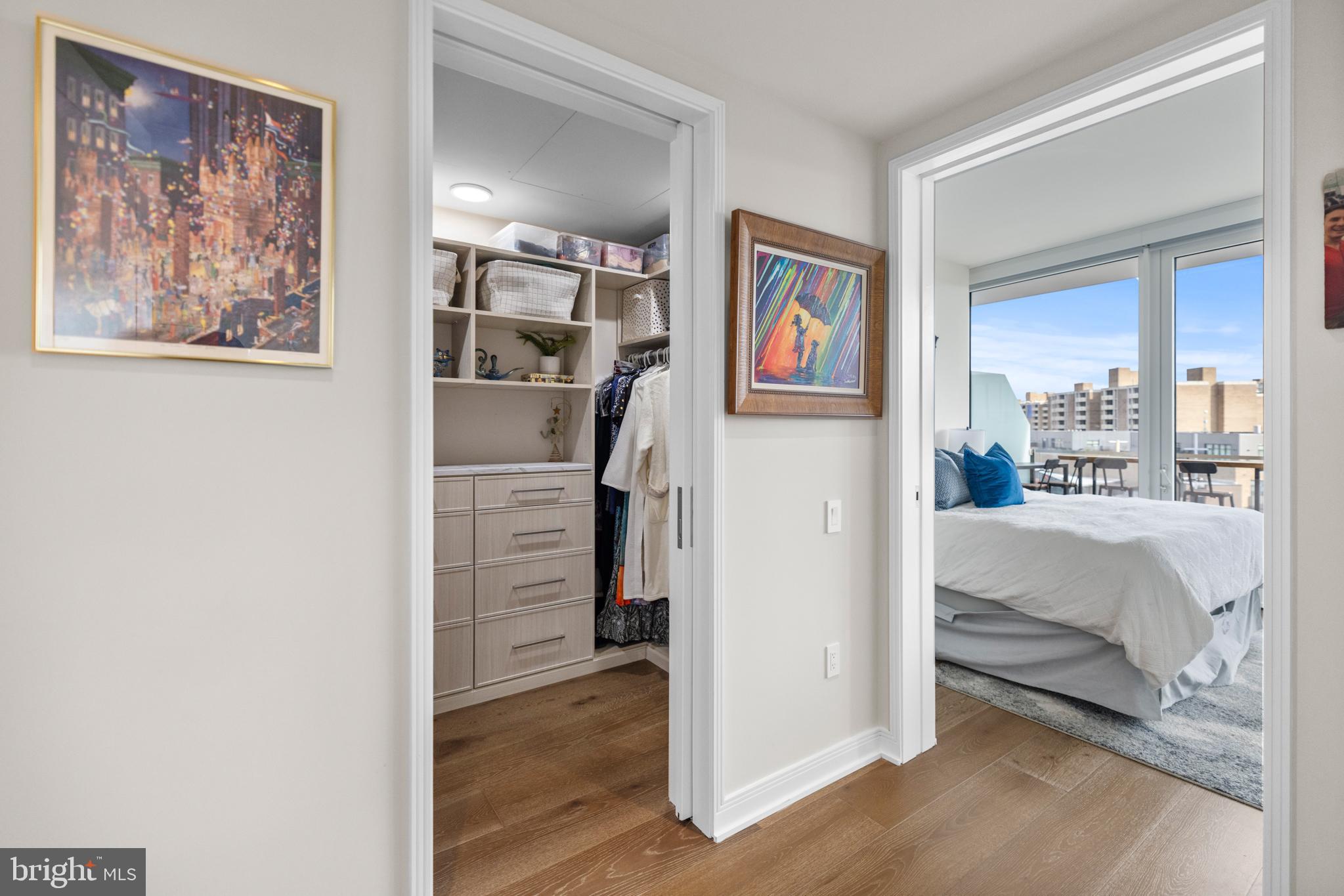 601 Wharf Street Southwest, Unit 602 Washington, DC 20024 - Photo 32 of 104 a bedroom with a bed and a painting on the wall