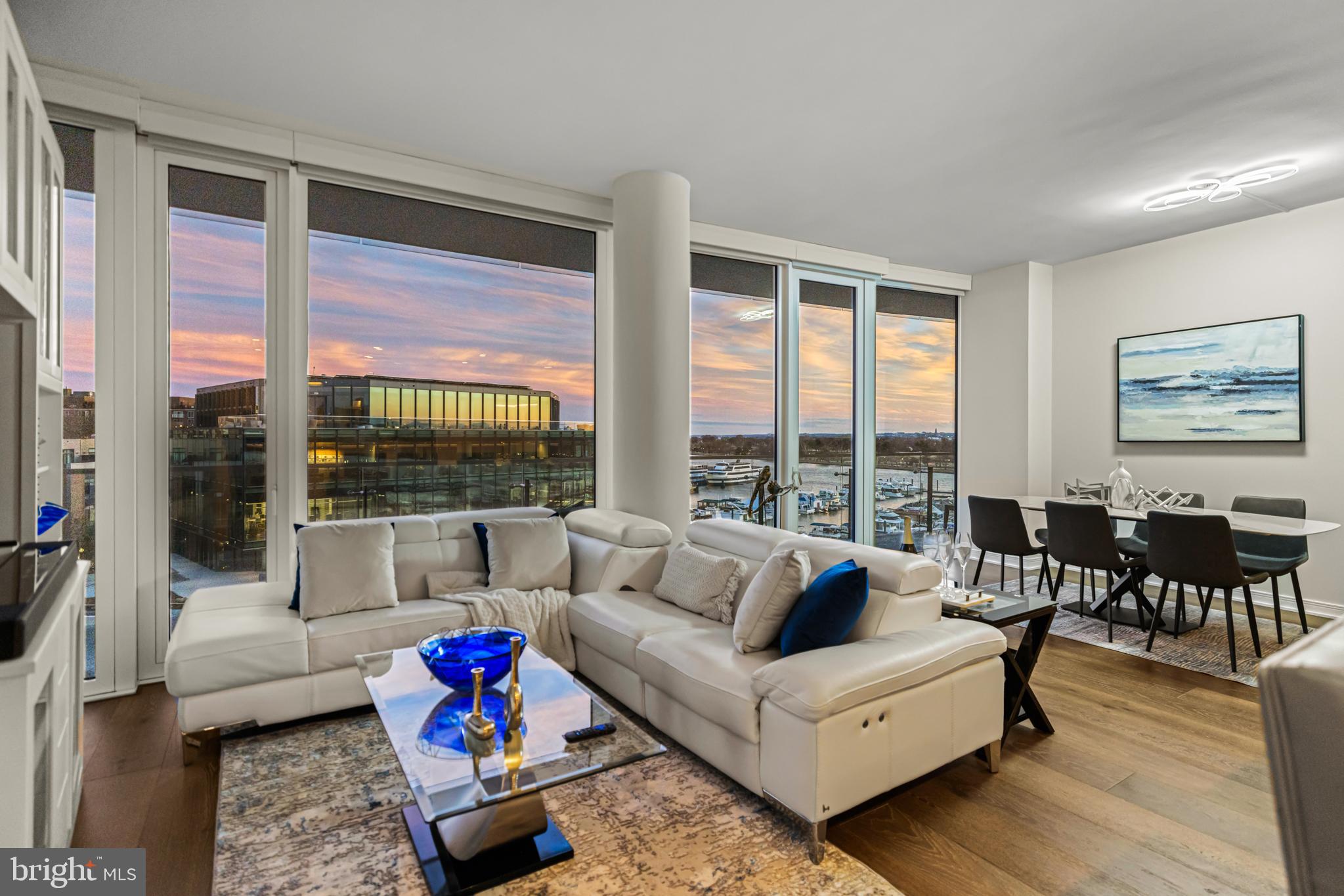 601 Wharf Street Southwest, Unit 602 Washington, DC 20024 - Photo 5 of 104 a living room with furniture and a large window