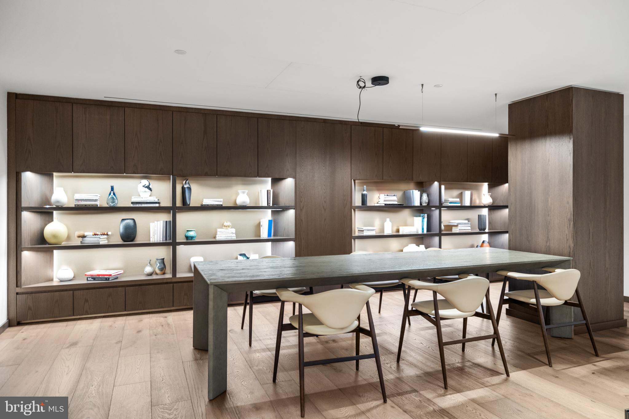 601 Wharf Street Southwest, Unit 602 Washington, DC 20024 - Photo 58 of 104 a kitchen with stainless steel appliances a table and chairs in it