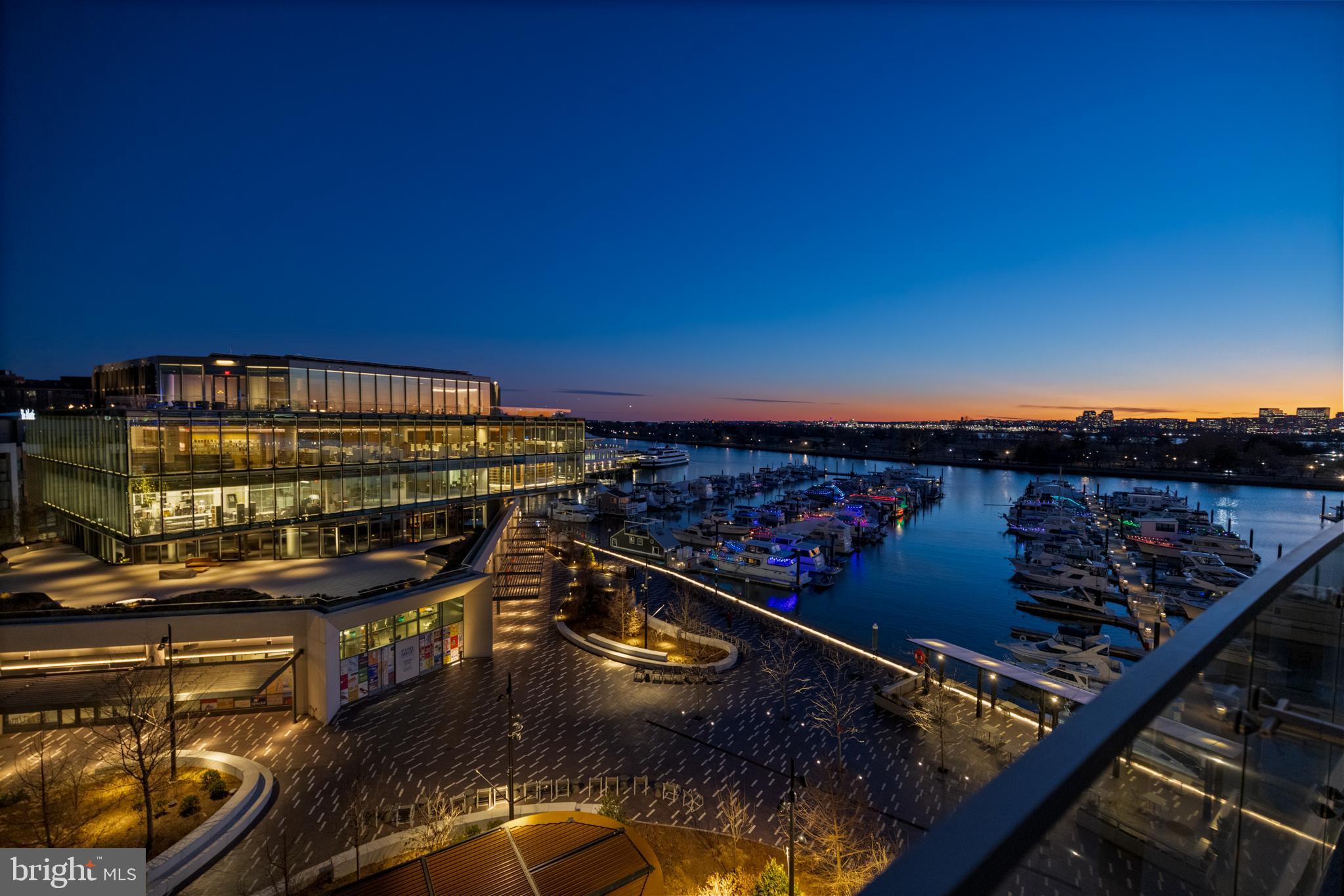 601 Wharf Street Southwest, Unit 602 Washington, DC 20024 - Photo 96 of 104 a view of a balcony with wooden floor and city view