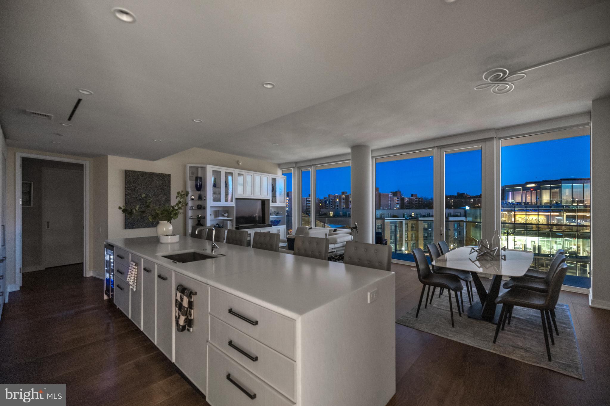 601 Wharf Street Southwest, Unit 602 Washington, DC 20024 - Photo 100 of 104 a kitchen with stainless steel appliances granite countertop a stove and a table