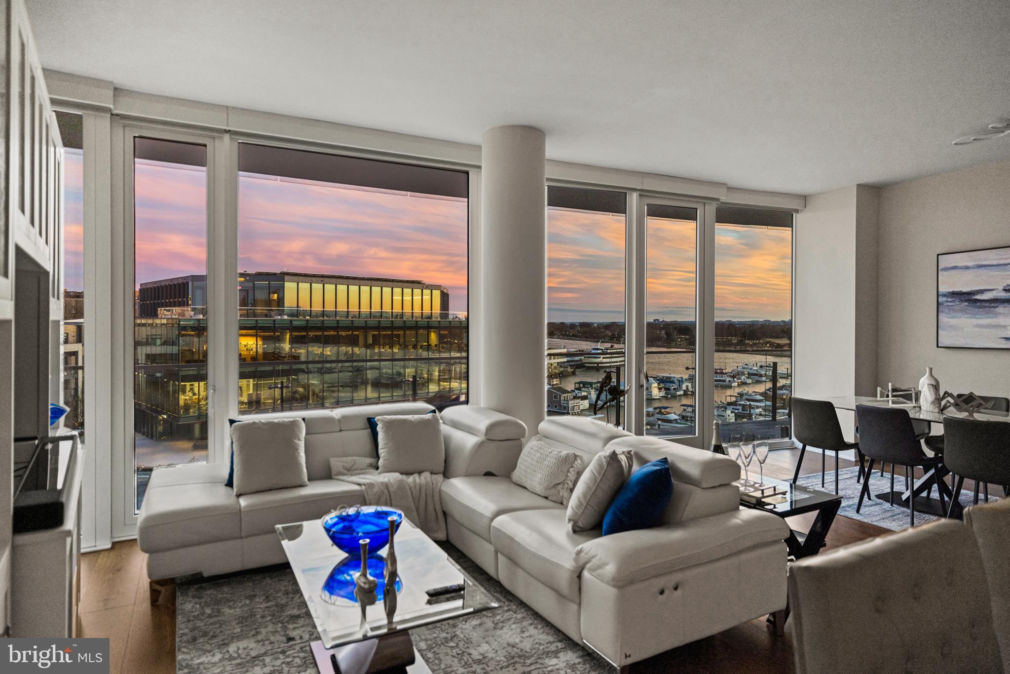 601 Wharf Street Southwest, Unit 602 Washington, DC 20024 - Photo 10 of 104 a living room with furniture and a large window