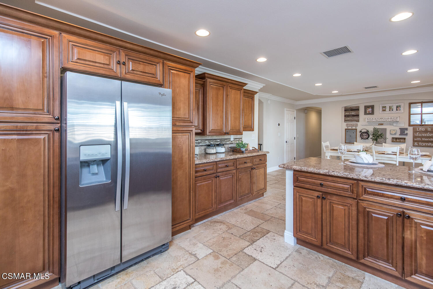 1871 Edgewood Drive Simi Valley, CA 93063 - Photo 12 of 26 a kitchen with kitchen island granite countertop stainless steel appliances cabinets and a counter top
