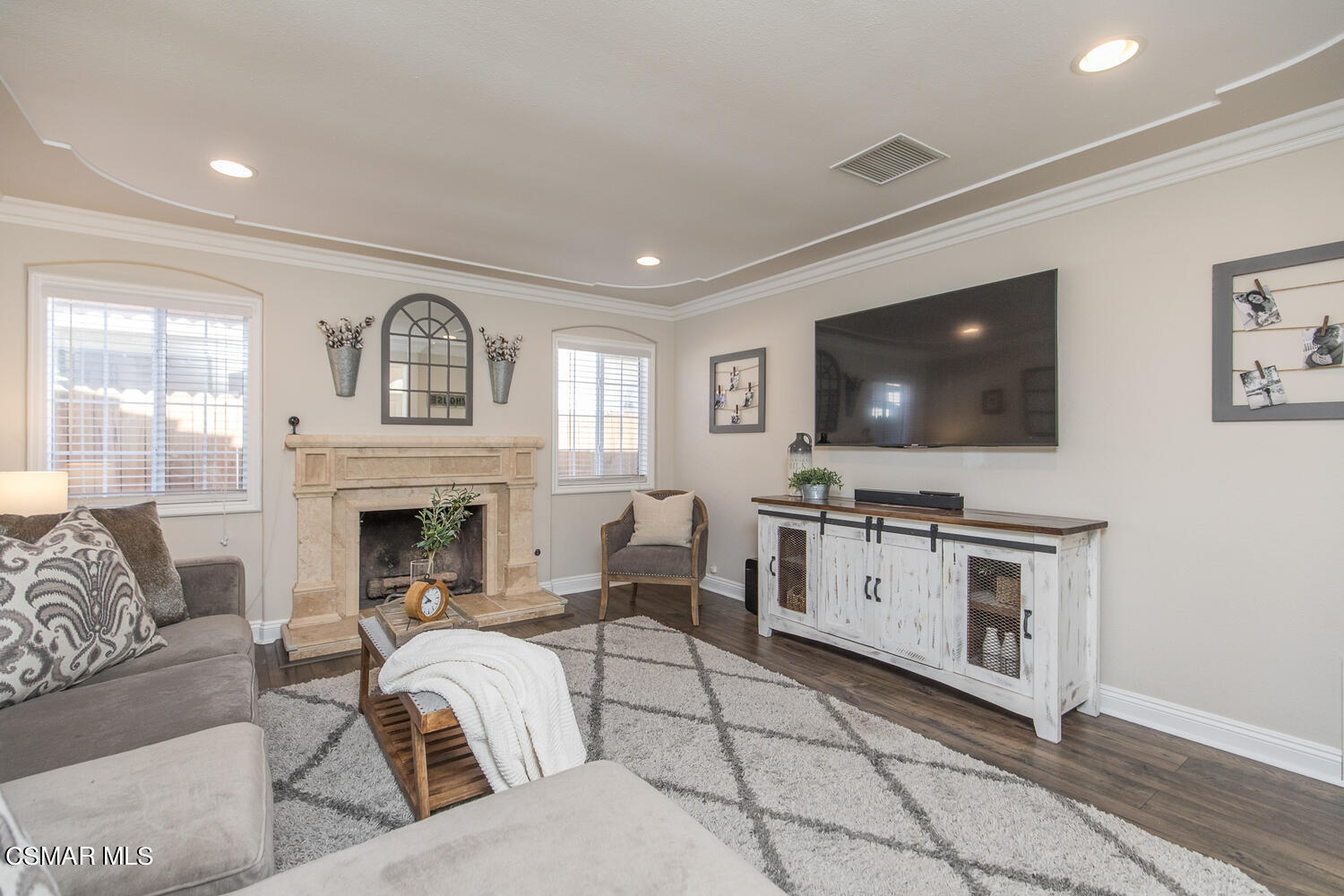 1871 Edgewood Drive Simi Valley, CA 93063 - Photo 6 of 26 a living room with furniture a flat screen tv and a fireplace