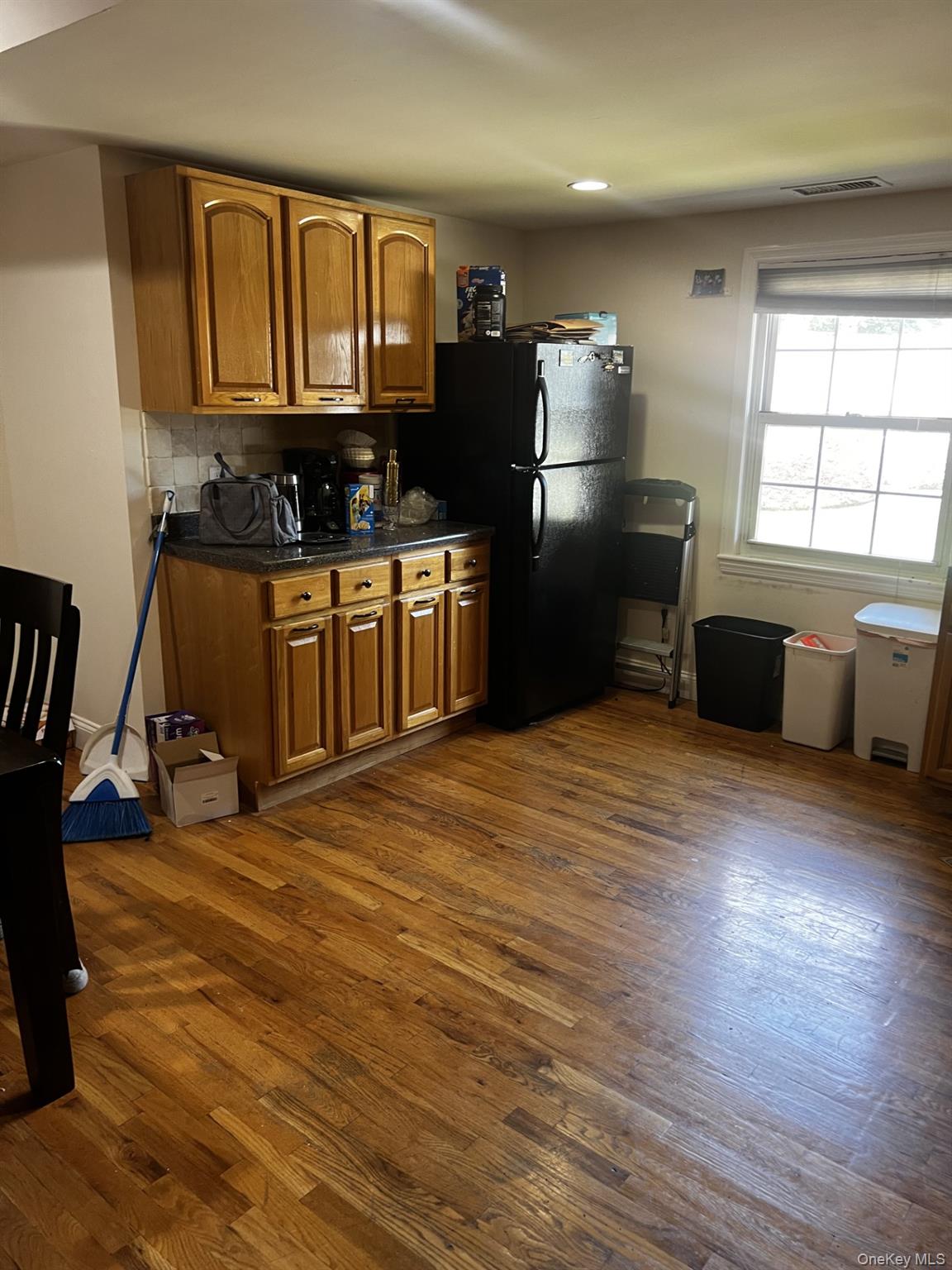 349 County Center Road, Unit TOP White Plains, NY 10603 - Photo 8 of 17 a kitchen with granite countertop a stove a refrigerator and wooden floor
