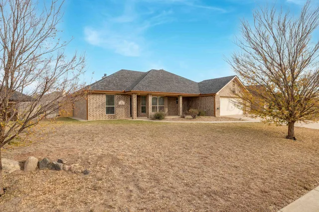 a house with yard in front of it