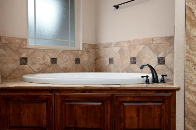 a bathroom with a sink and a shower