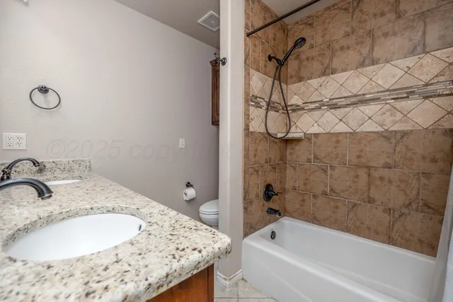 a bathroom with a bathtub and shower