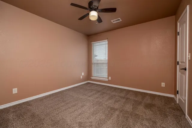 a backyard of a house with a yard and garage