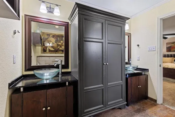 a kitchen with a refrigerator and a stove