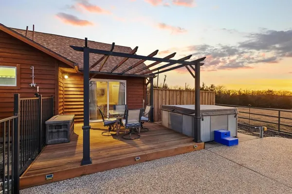 a view of a terrace with couches and sky view