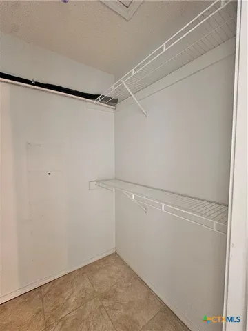 a view of an empty walk in closet