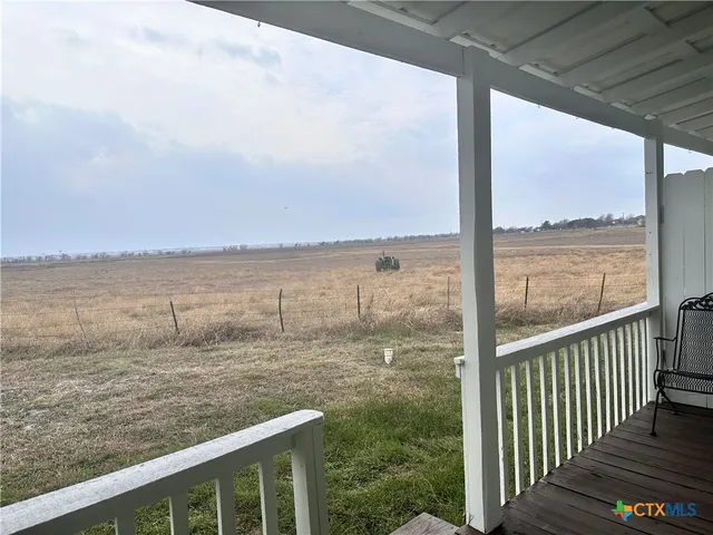 a view of a lake from a balcony