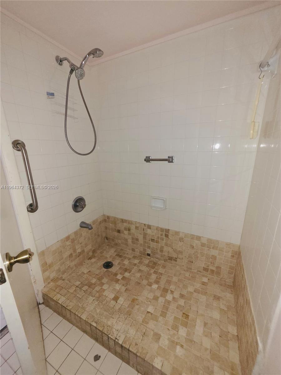 725 Northwest 123rd Avenue Miami, FL 33182 - Photo 14 of 18 a bathroom with a shower