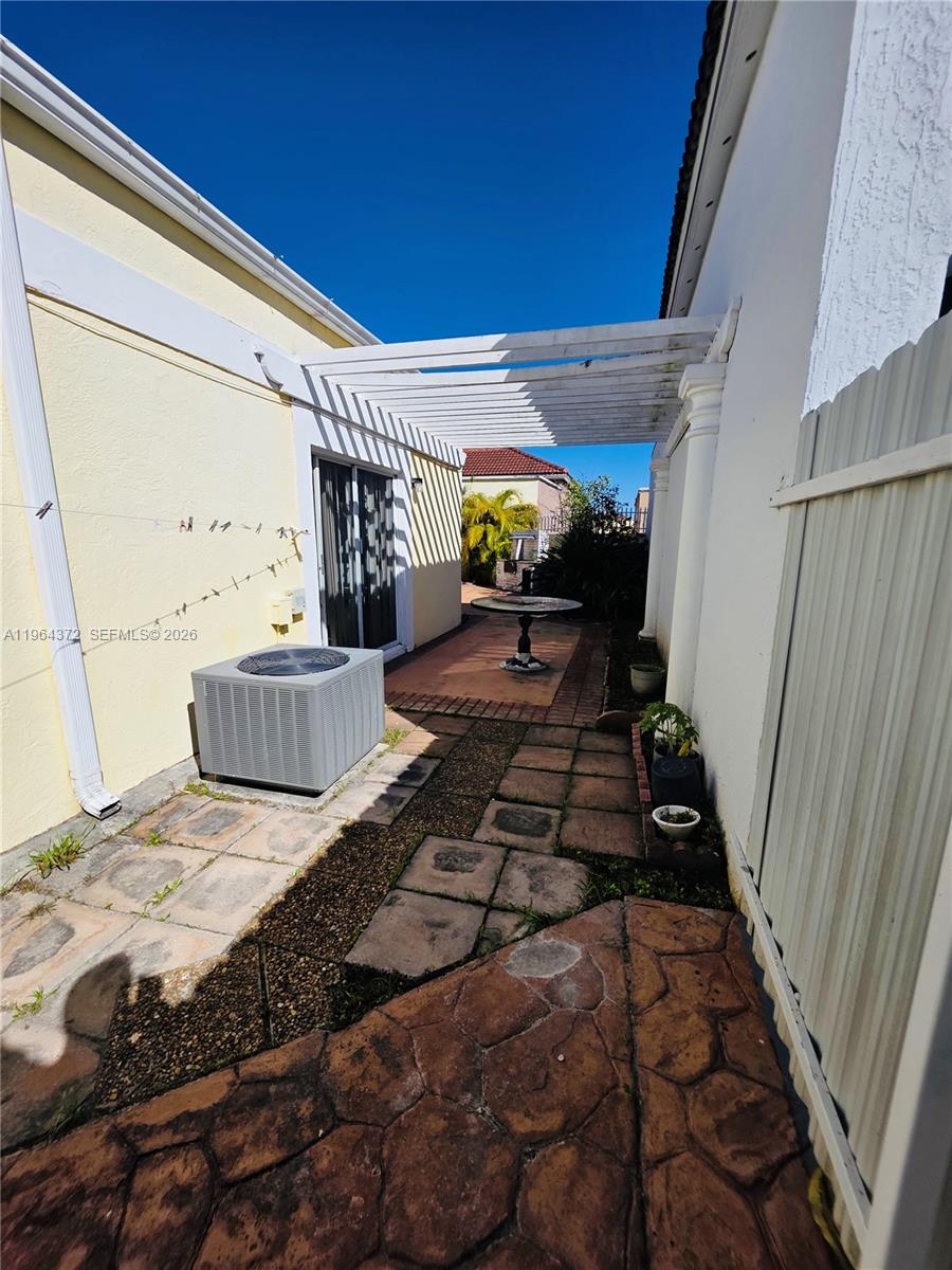 725 Northwest 123rd Avenue Miami, FL 33182 - Photo 18 of 18 a bedroom with bed and a window