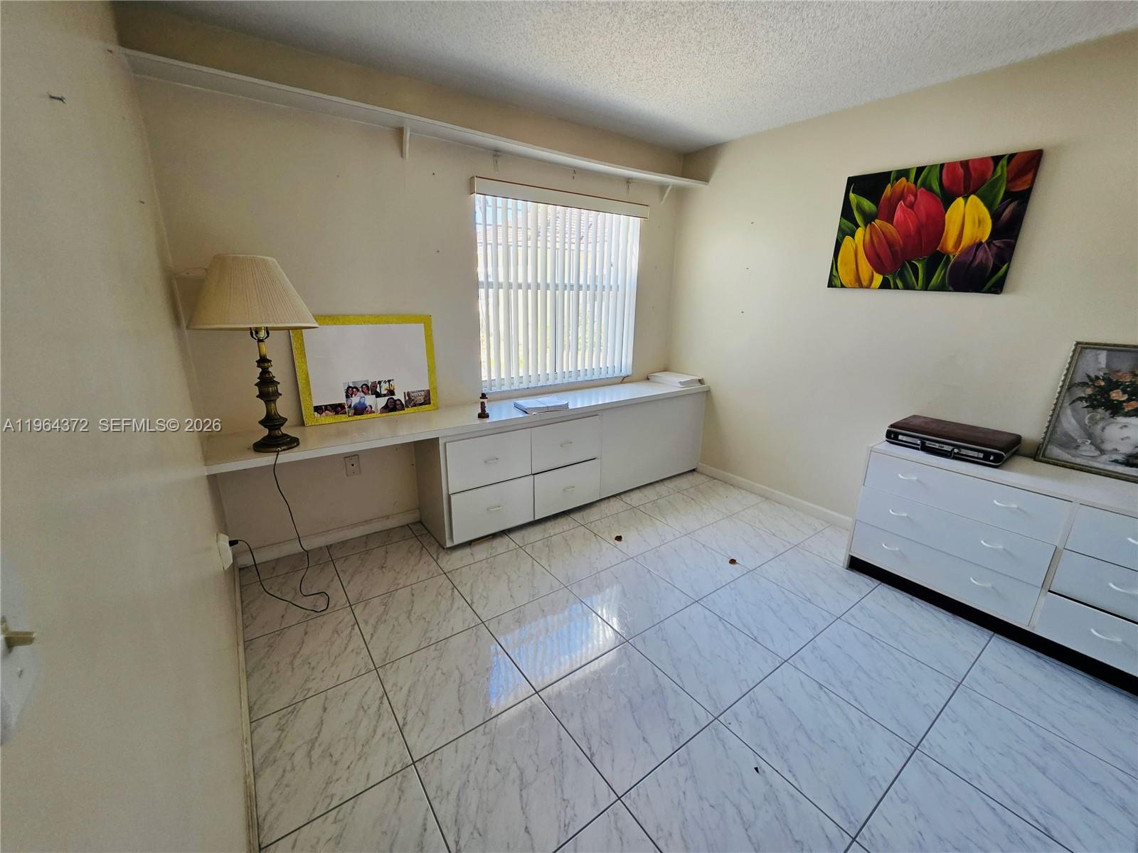 725 Northwest 123rd Avenue Miami, FL 33182 - Photo 9 of 18 a living room with furniture and a window