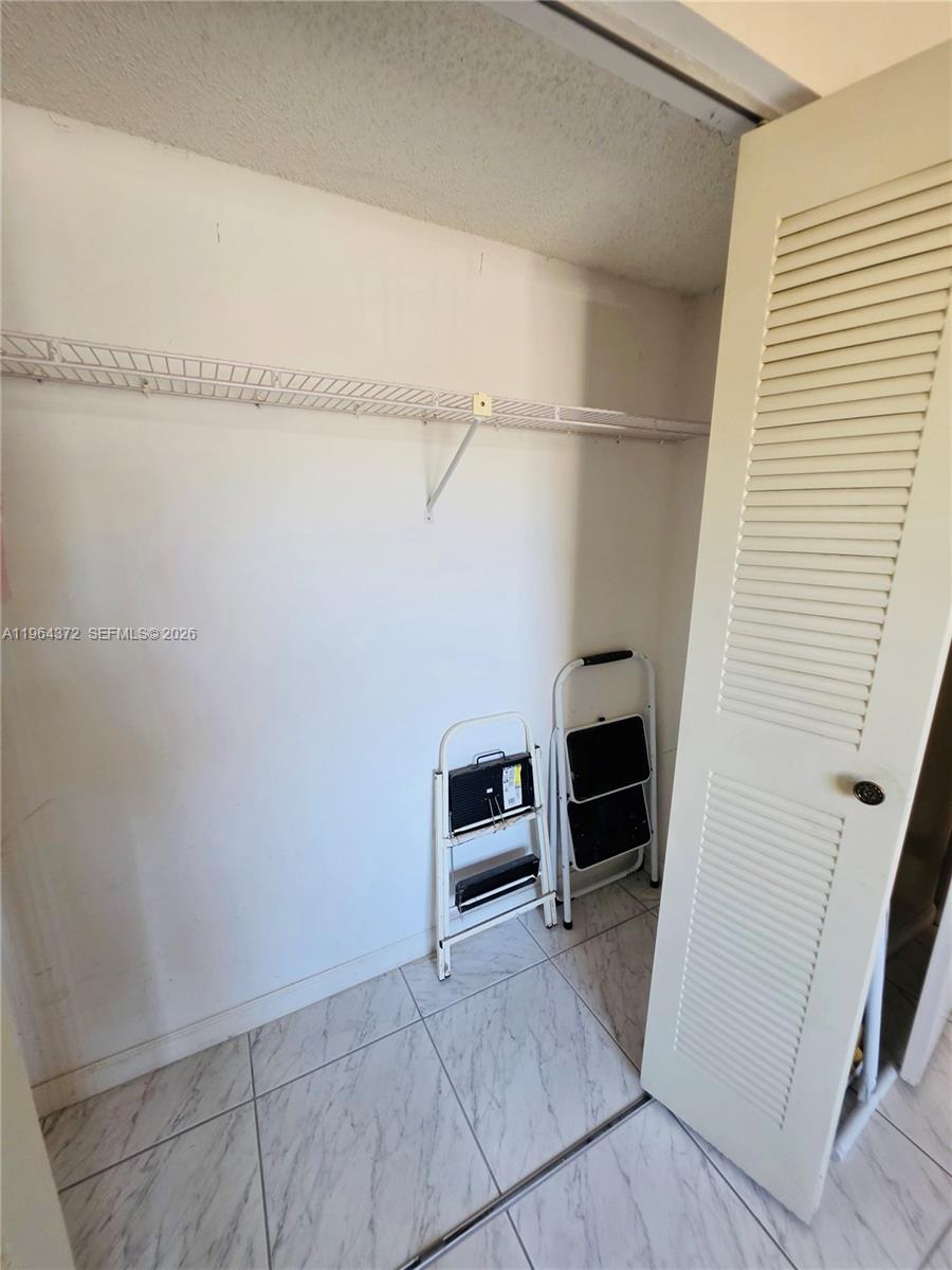 725 Northwest 123rd Avenue Miami, FL 33182 - Photo 10 of 18 a view of a livingroom with an empty space and a window