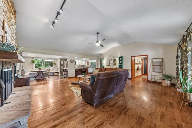 a kitchen with stainless steel appliances granite countertop a sink and a stove