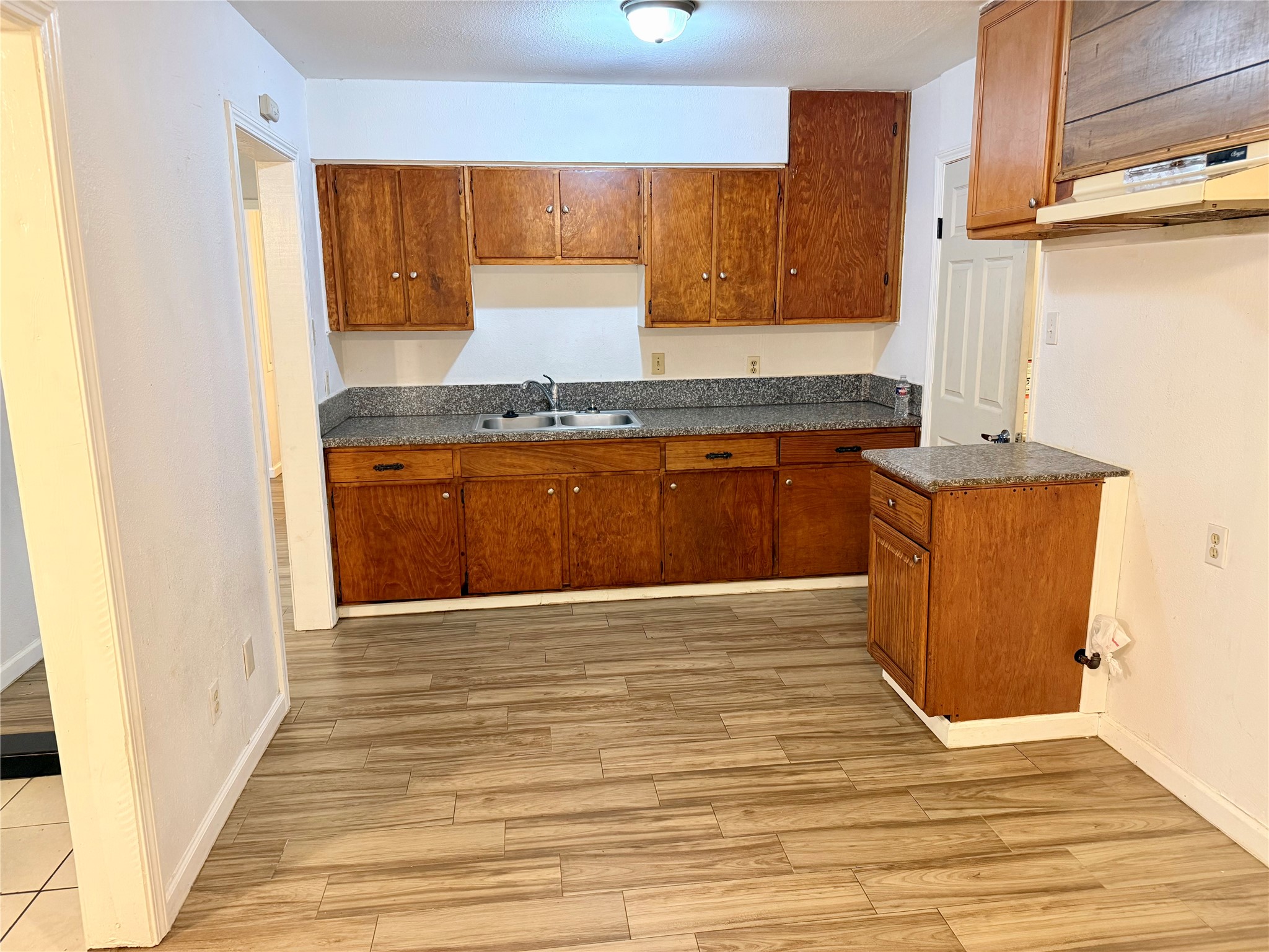10618 Leitrim Way Houston, TX 77047 - Photo 4 of 13 a kitchen with stainless steel appliances granite countertop a sink stove and cabinets