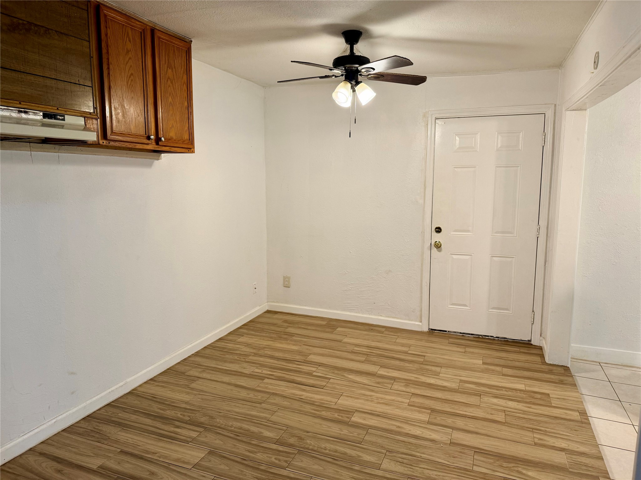 10618 Leitrim Way Houston, TX 77047 - Photo 5 of 13 a view of an empty room with wooden floor