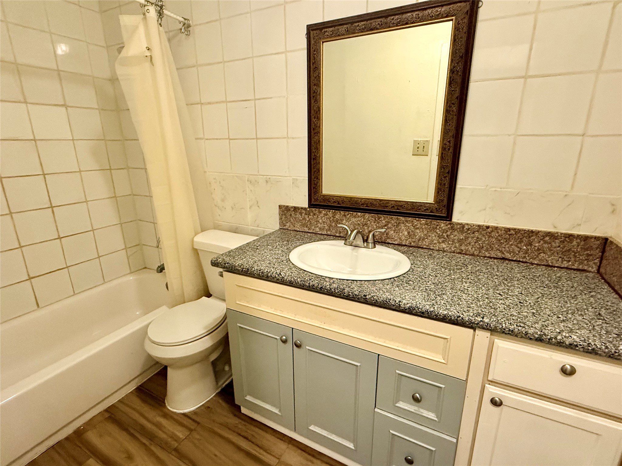 10618 Leitrim Way Houston, TX 77047 - Photo 10 of 13 a bathroom with a sink and a mirror
