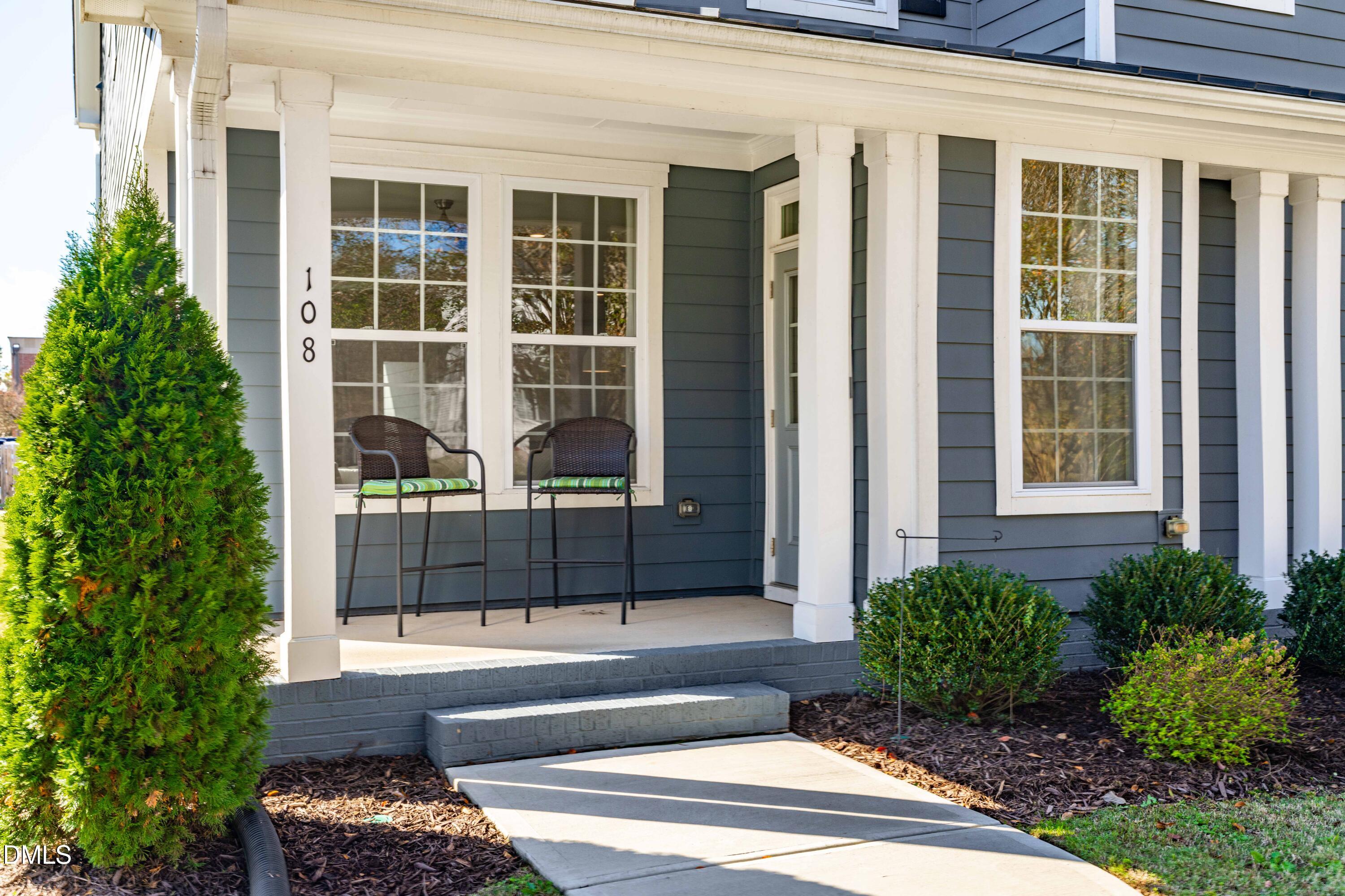 108 Bridge Street Smithfield, NC 27577 - Photo 45 of 48 a front view of a house with a yard and potted plants