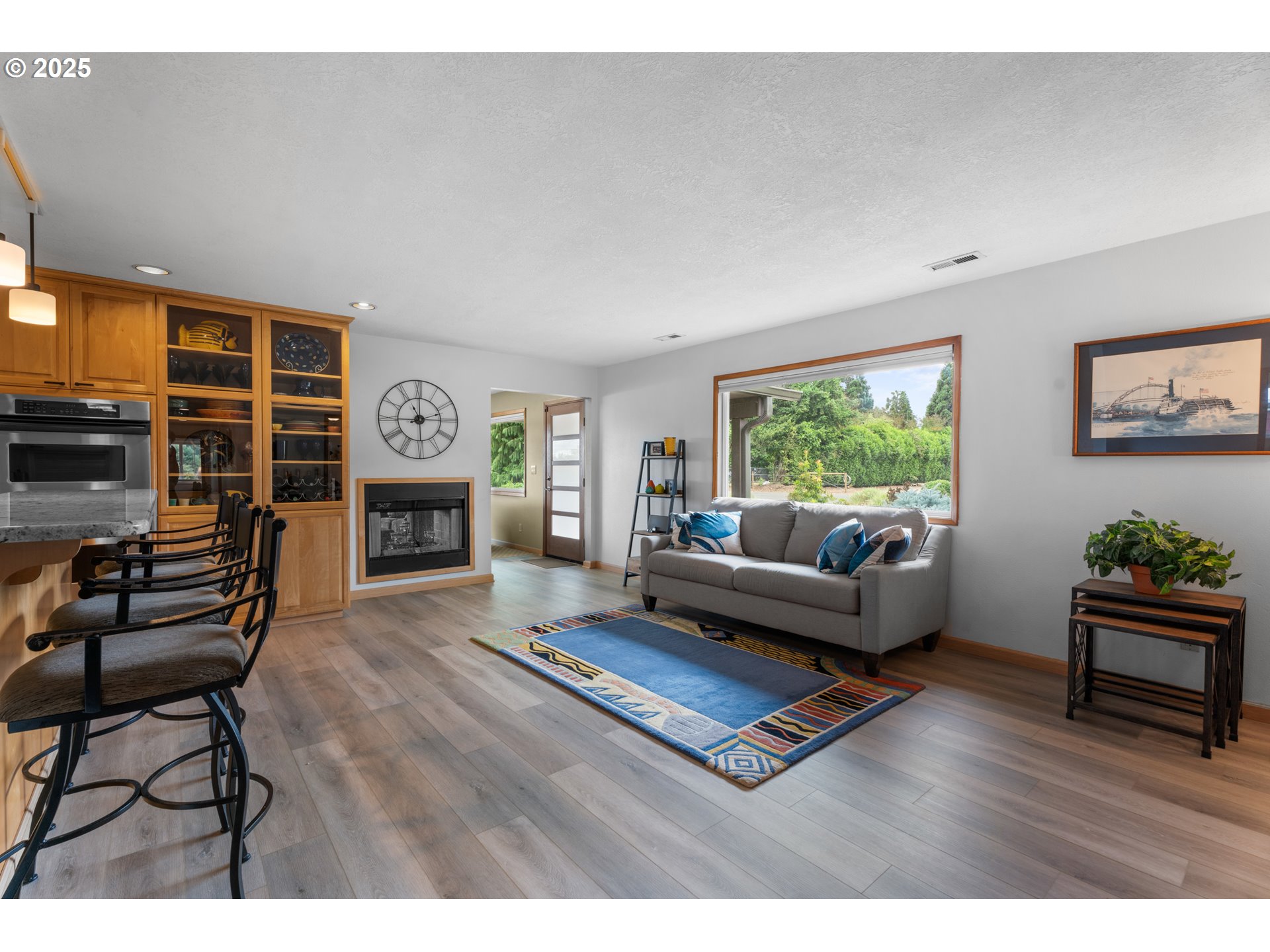 8747 South Heinz Road Canby, OR 97013 - Photo 13 of 48 a living room with furniture and a fireplace