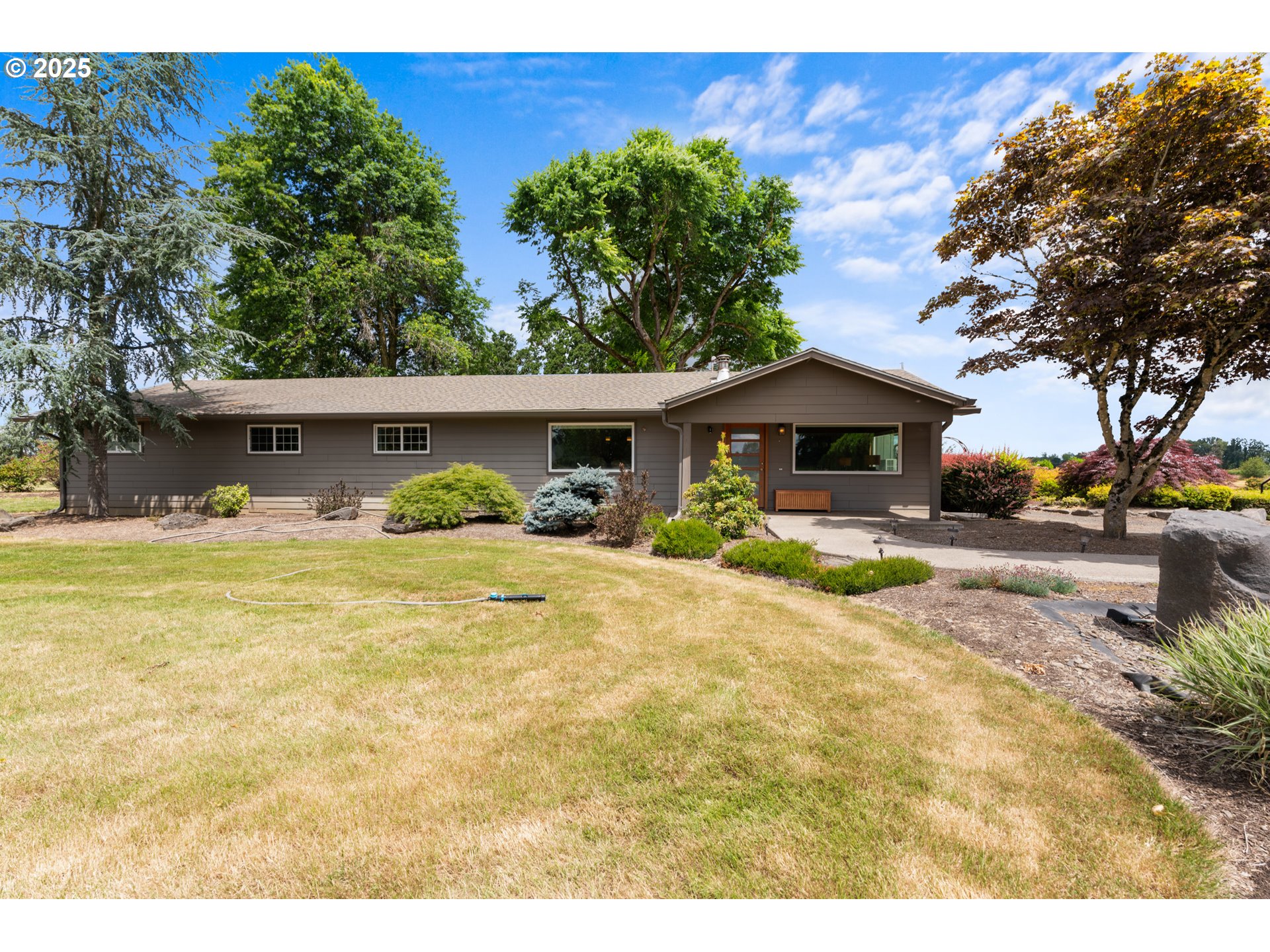 8747 South Heinz Road Canby, OR 97013 - Photo 41 of 48 a front view of a house with swimming pool