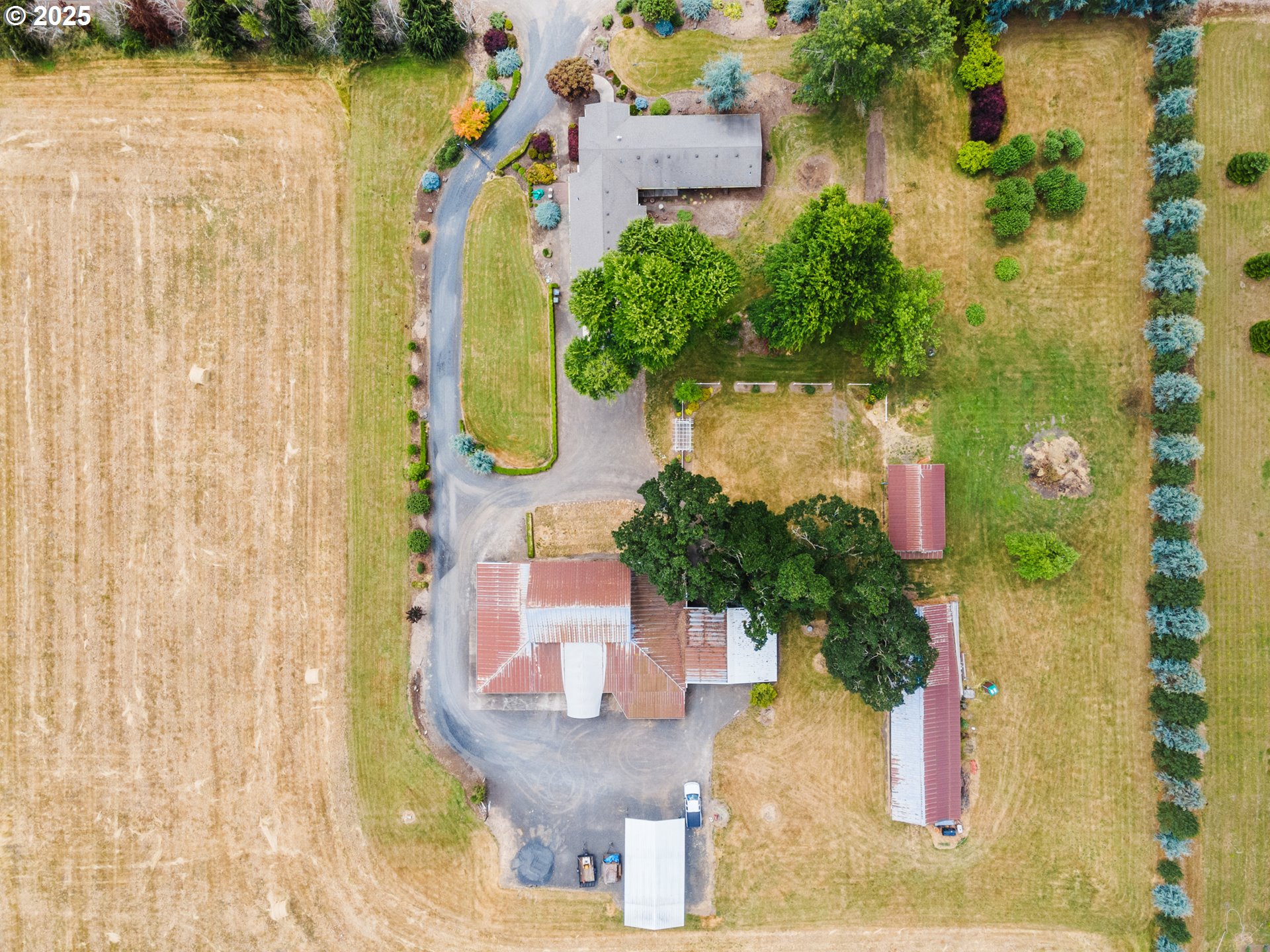 8747 South Heinz Road Canby, OR 97013 - Photo 43 of 48 an aerial view of residential houses with outdoor space