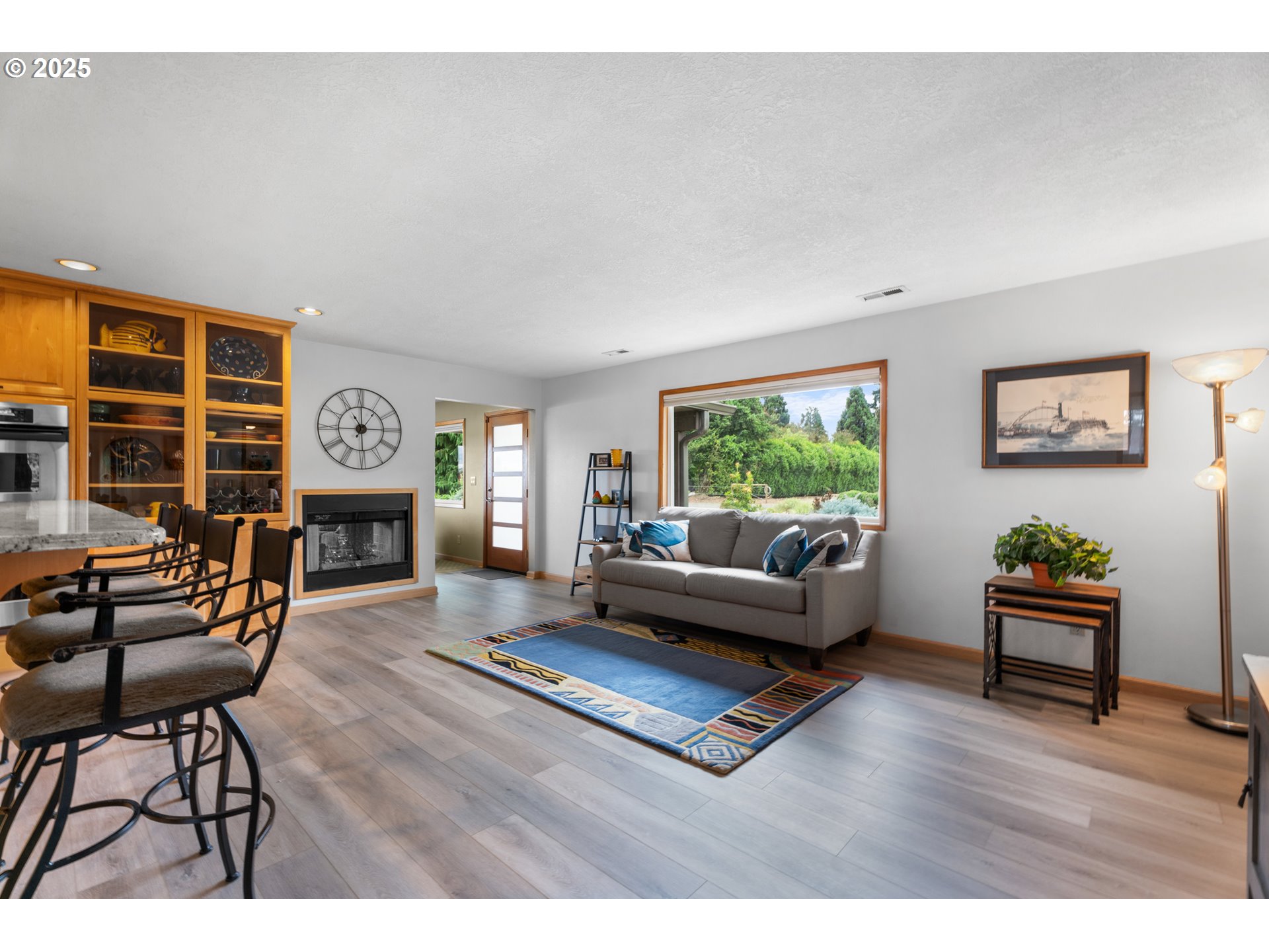8747 South Heinz Road Canby, OR 97013 - Photo 9 of 48 a living room with furniture and a fireplace
