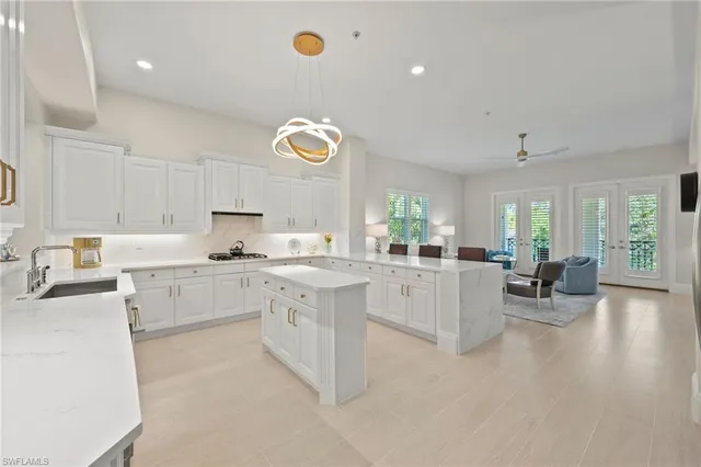 a kitchen with a sink cabinets and window