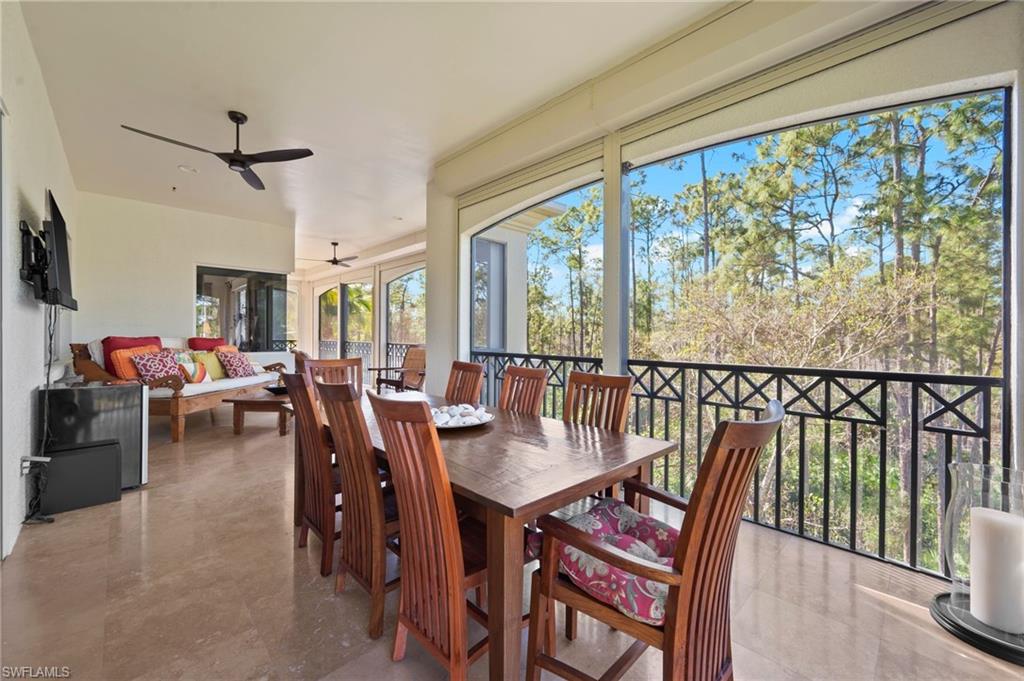 2886 Castillo Court, Unit 103 Naples, FL 34109 - Photo 15 of 38 a view of a dining room with furniture window and outside view