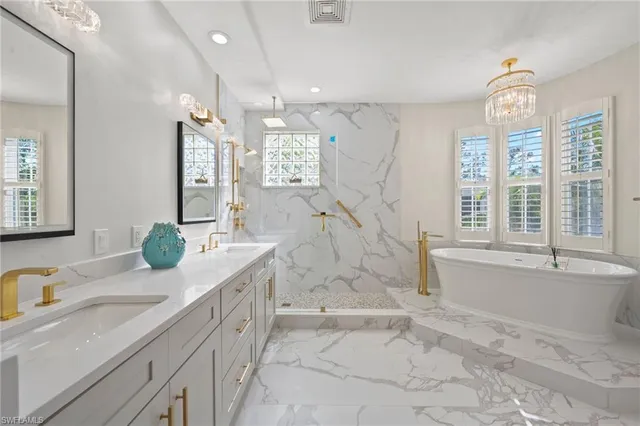 a bath tub sitting next to a window