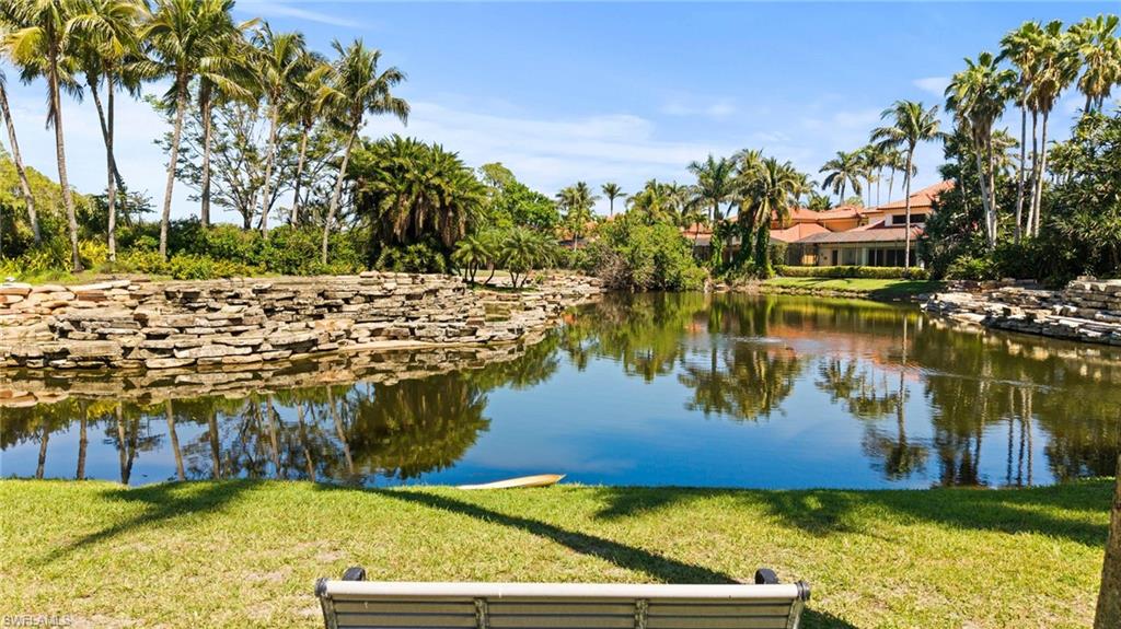 2886 Castillo Court, Unit 103 Naples, FL 34109 - Photo 33 of 38 a view of a lake with houses