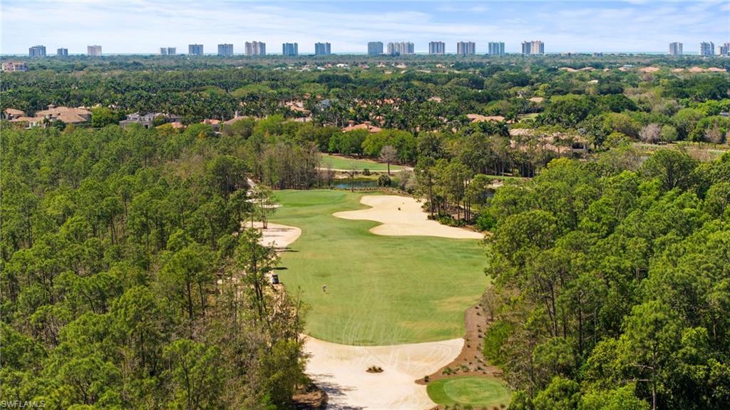 2886 Castillo Court, Unit 103 Naples, FL 34109 - Photo 37 of 38 a view of a lake with a city