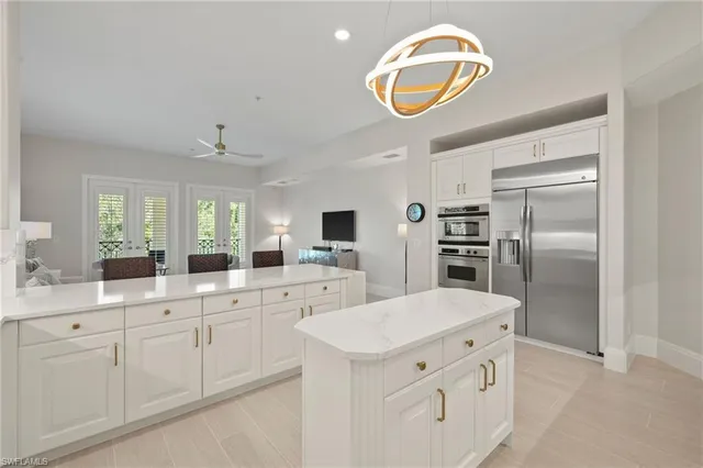 a kitchen with cabinets and stainless steel appliances