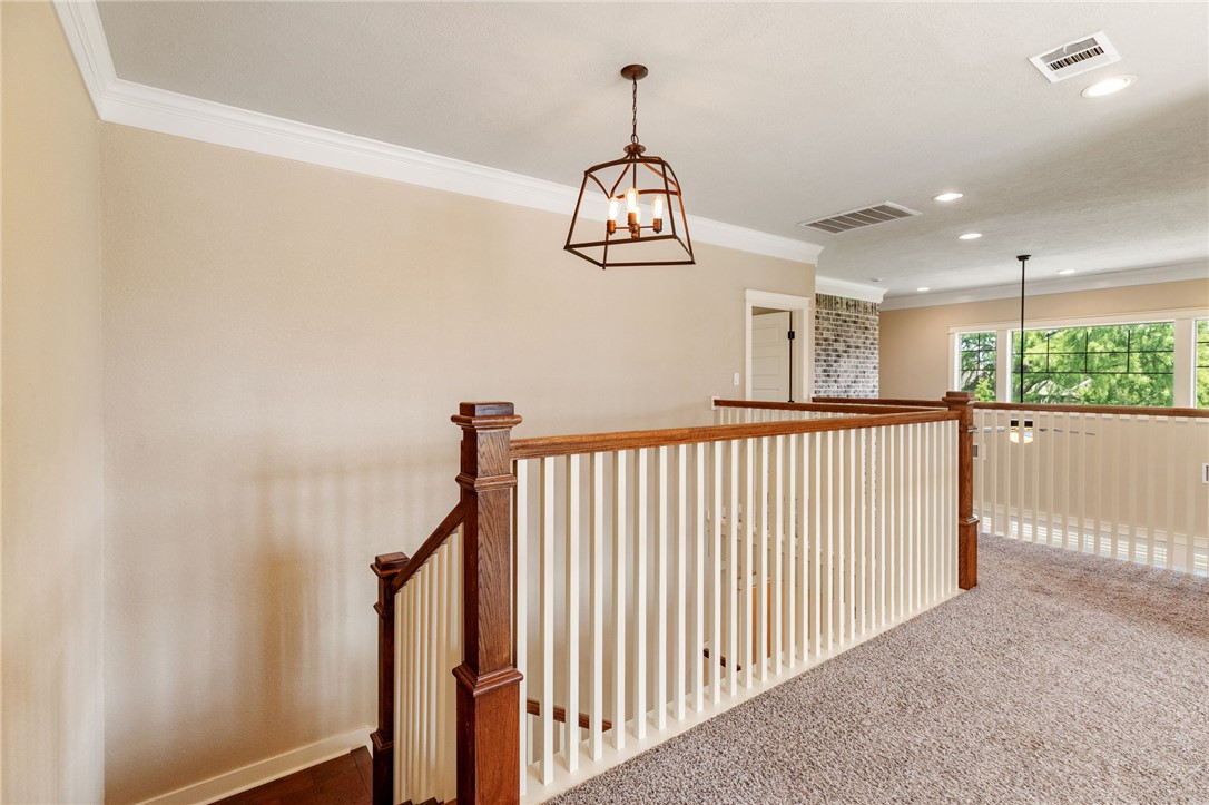 2136 Rockcliffe Loop College Station, TX 77845 - Photo 35 of 48 a view of a hallway with a chandelier