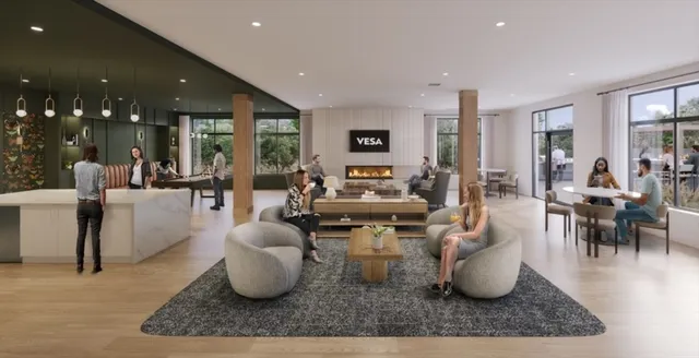 a living room with couches a coffee table and chairs with wooden floor