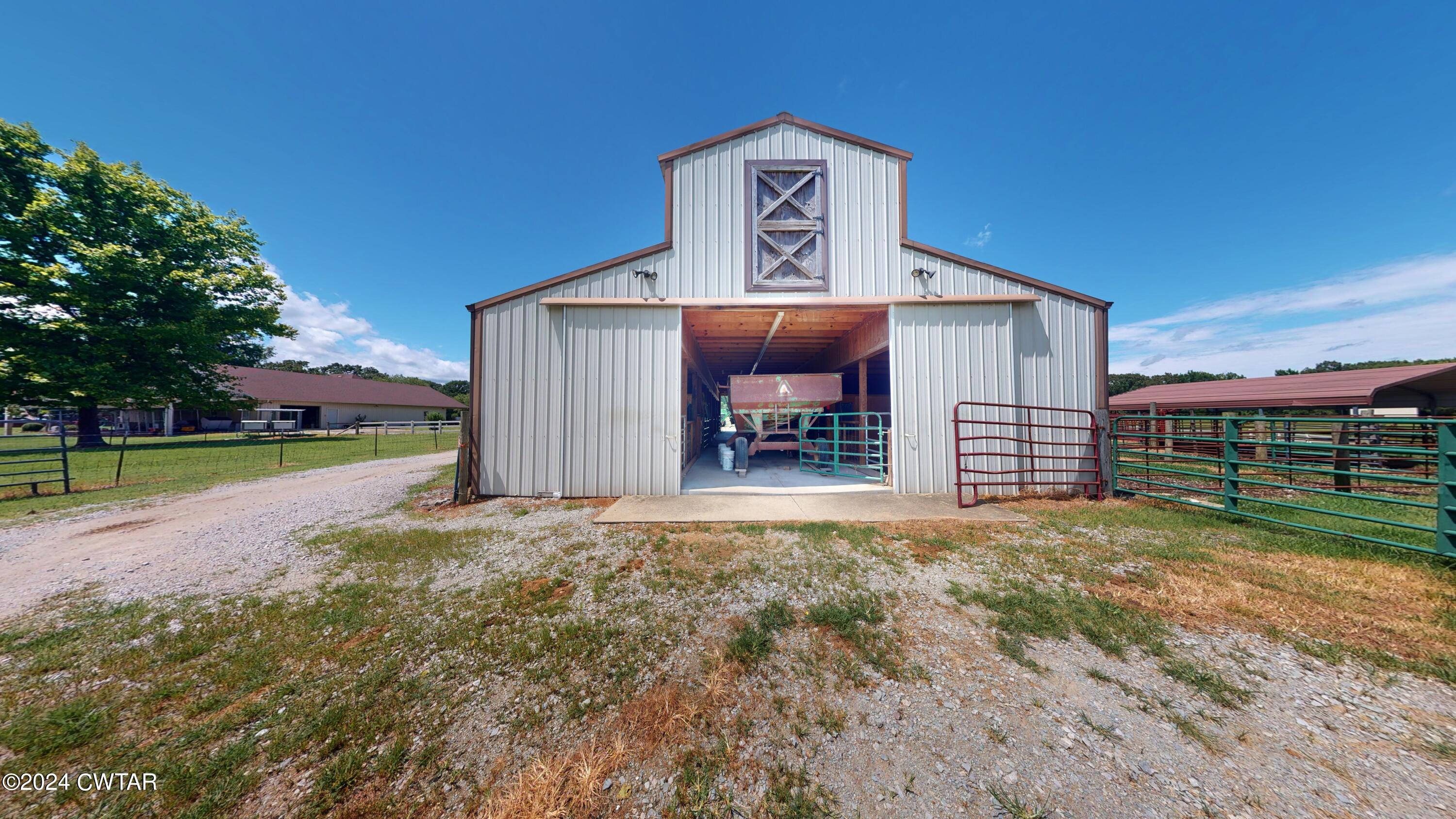 900 Cotton Grove Road Jackson, TN 38305 - Photo 54 of 75 a view of a house with backyard and porch
