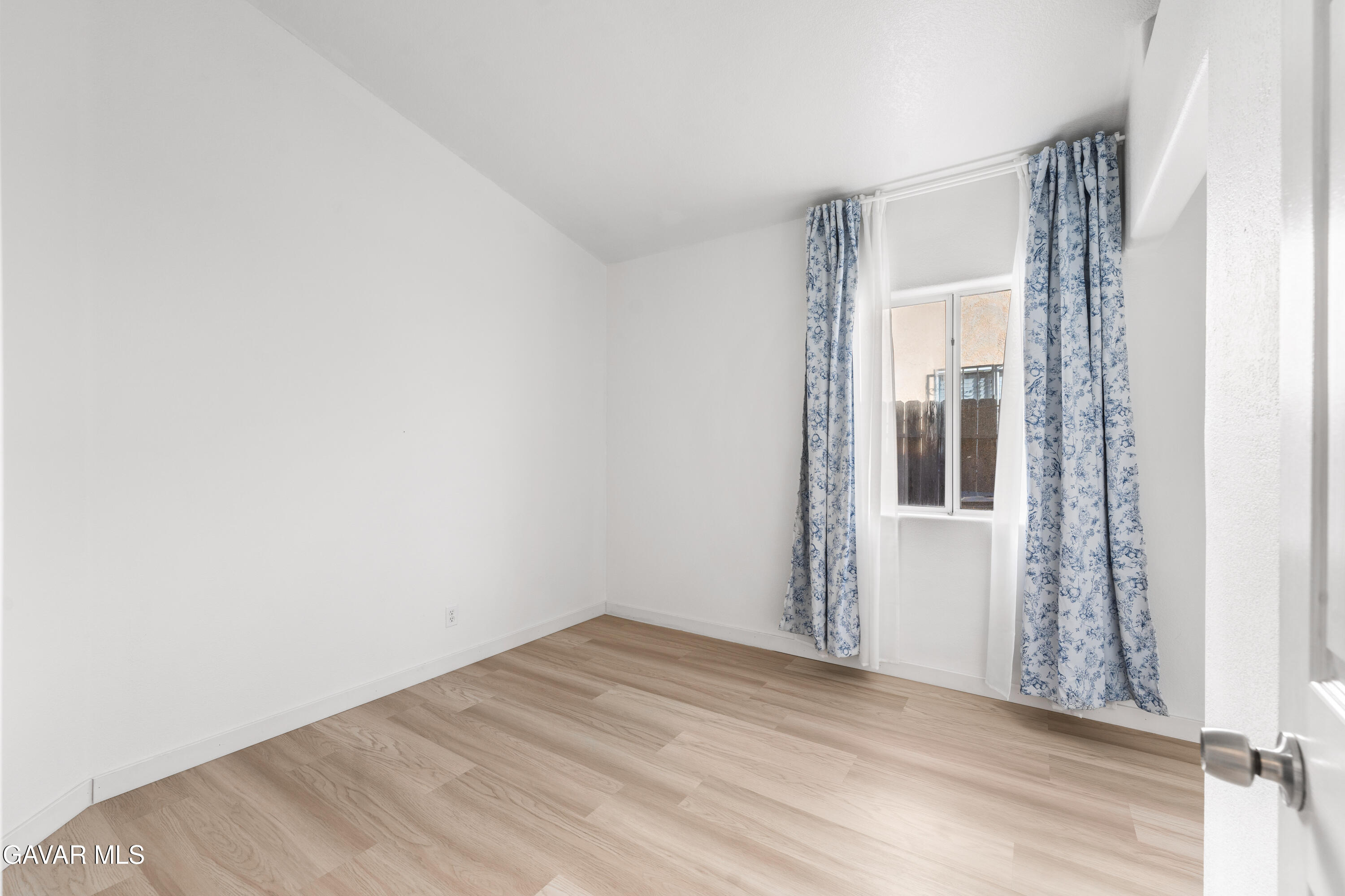 1639 East Kettering Street Lancaster, CA 93535 - Photo 21 of 35 a view of a room with wooden floor and windows