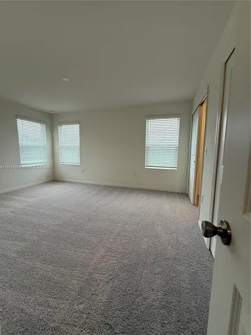 a bathroom with a granite countertop toilet a sink and a bathtub