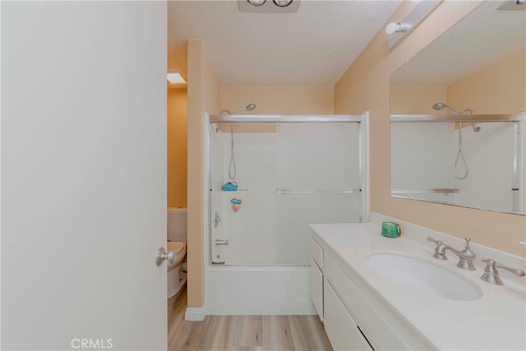 22224 South Vermont Avenue, Unit 102C Torrance, CA 90502 - Photo 14 of 27 a bathroom with a tub sink vanity and mirror