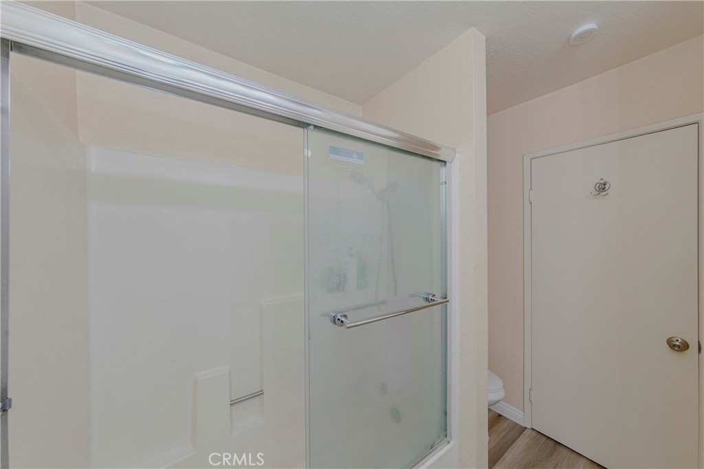 22224 South Vermont Avenue, Unit 102C Torrance, CA 90502 - Photo 17 of 27 a bathroom with a glass shower door