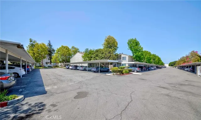 a view of a cars parked in front of a house