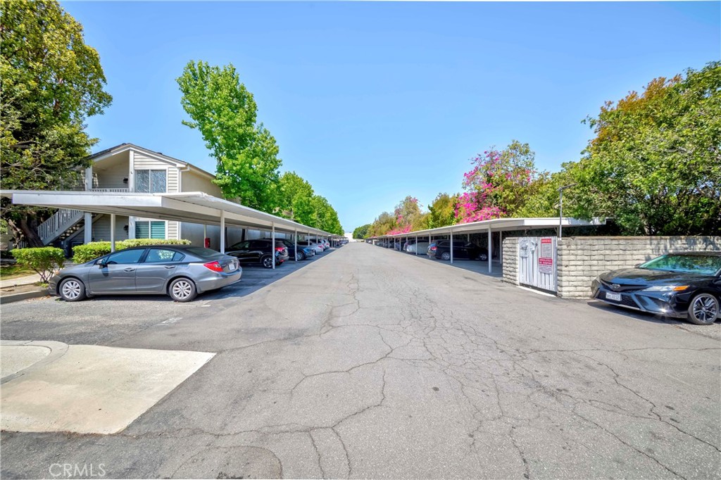 22224 South Vermont Avenue, Unit 102C Torrance, CA 90502 - Photo 27 of 27 a view of a cars parked in front of a house