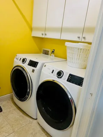 a white toilet sitting next to a bath tub
