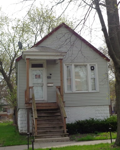 6925 South May Street Chicago, IL 60621 - Photo 1 of 1 a front view of a house with a yard