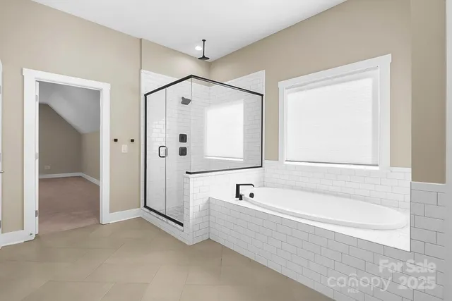 an empty room with closet and a window