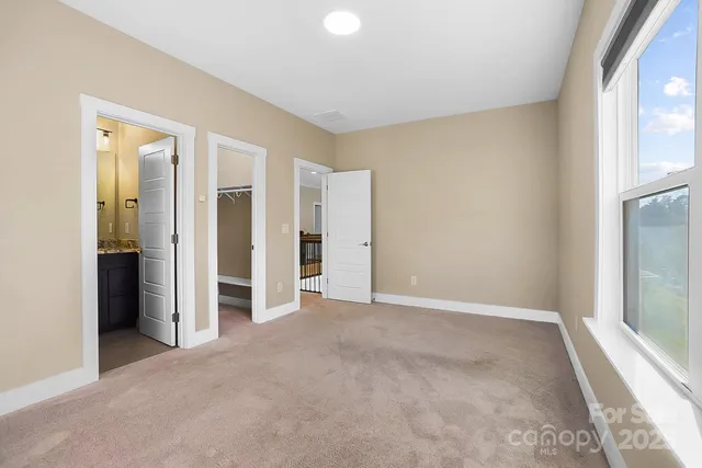 a view of a balcony with wooden floor and fence