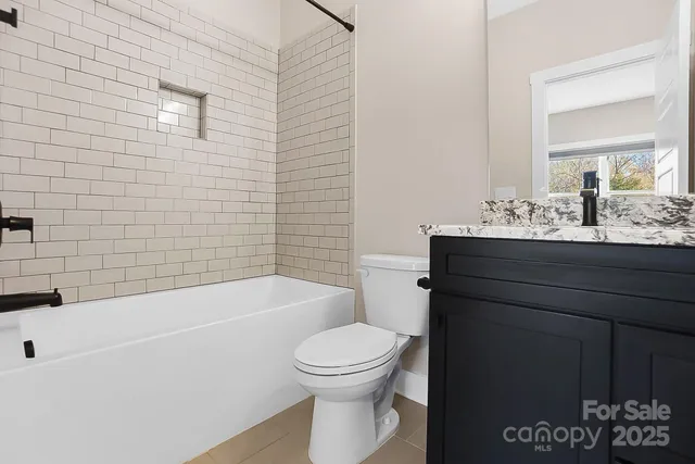 a view of a swimming pool with lounge chairs